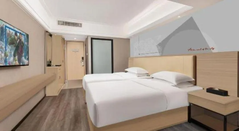 Bed in Borrman Hotel Guangzhou Railway Station Sanyuanli Metro Station