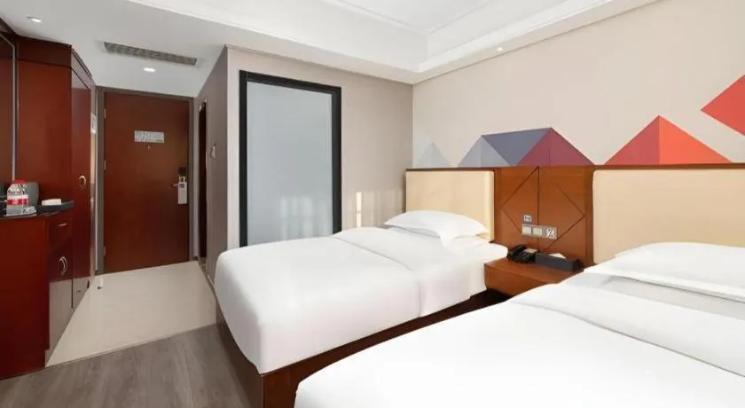 Bed in Borrman Hotel Guangzhou Railway Station Sanyuanli Metro Station