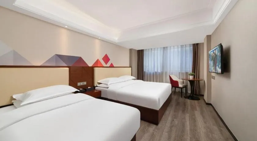 Bed in Borrman Hotel Guangzhou Railway Station Sanyuanli Metro Station