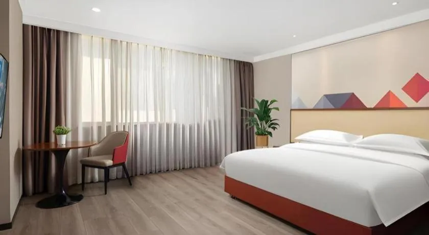 Bed in Borrman Hotel Guangzhou Railway Station Sanyuanli Metro Station