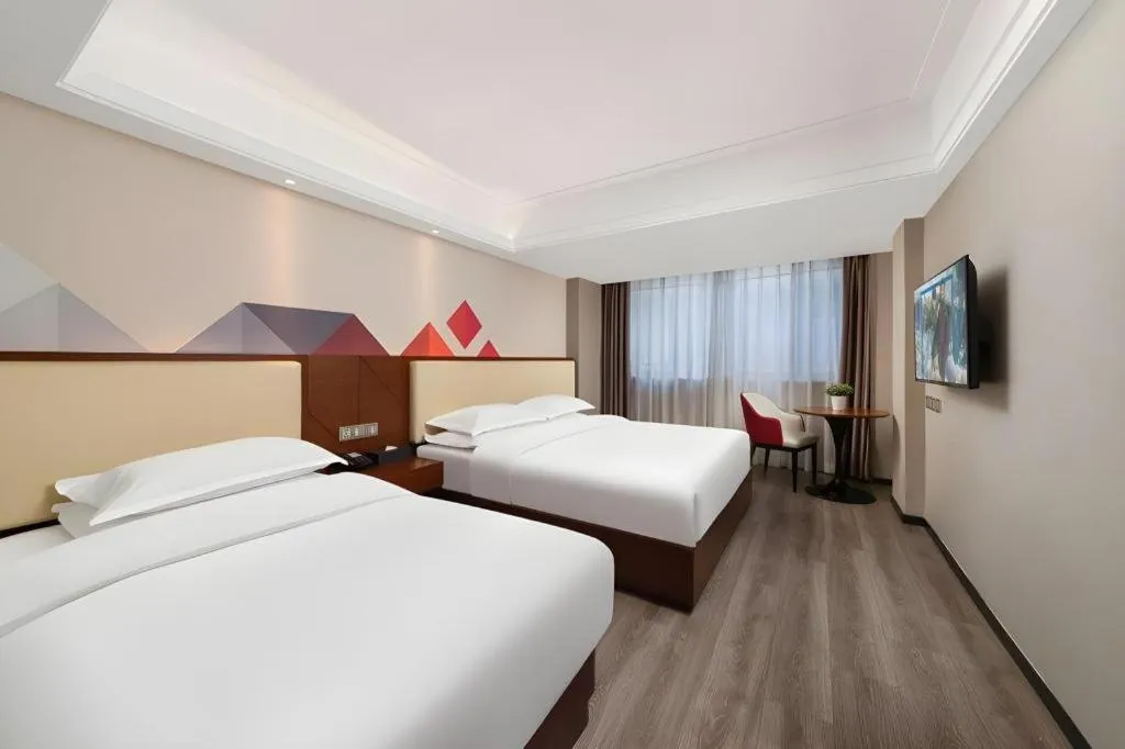 Bed in Borrman Hotel Guangzhou Railway Station Sanyuanli Metro Station