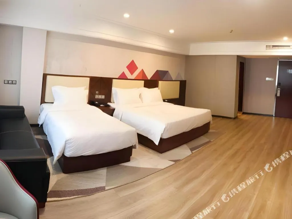 Bed in Borrman Hotel Guangzhou Railway Station Sanyuanli Metro Station