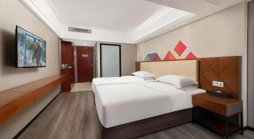 Bed in Borrman Hotel Guangzhou Railway Station Sanyuanli Metro Station