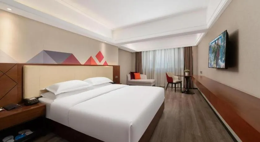 Bed in Borrman Hotel Guangzhou Railway Station Sanyuanli Metro Station