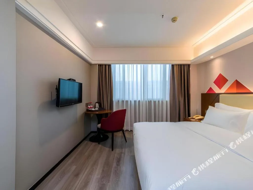 Bed in Borrman Hotel Guangzhou Railway Station Sanyuanli Metro Station