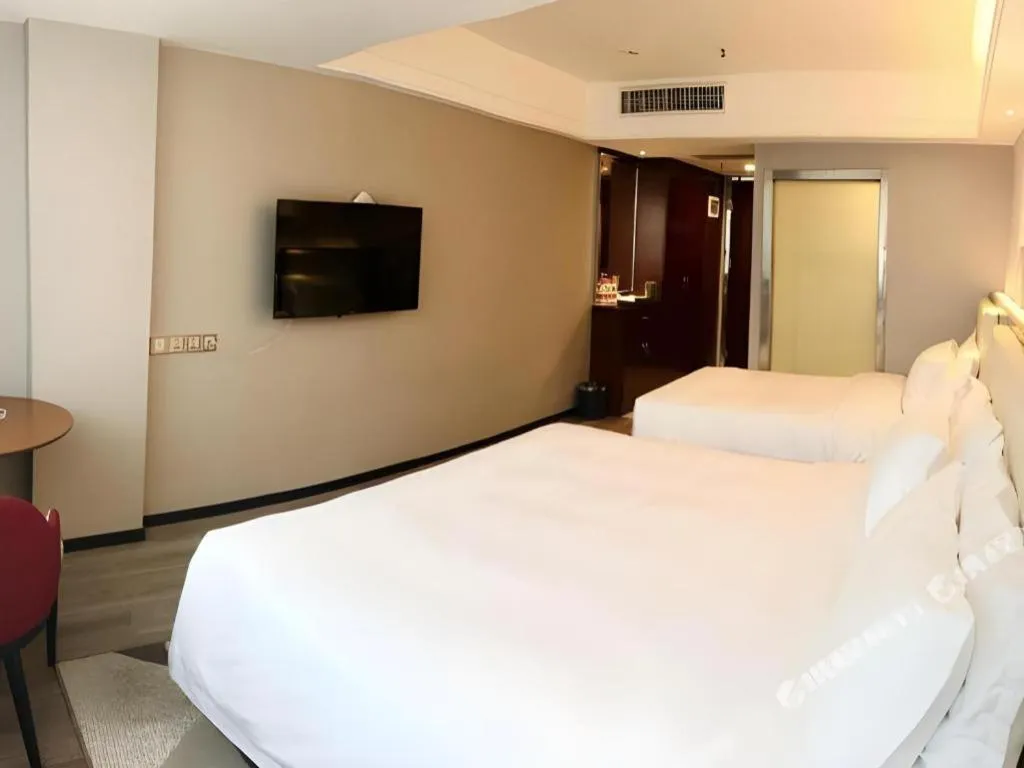 Bed in Borrman Hotel Guangzhou Railway Station Sanyuanli Metro Station