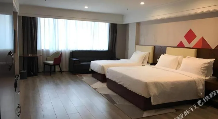 Bed in Borrman Hotel Guangzhou Railway Station Sanyuanli Metro Station