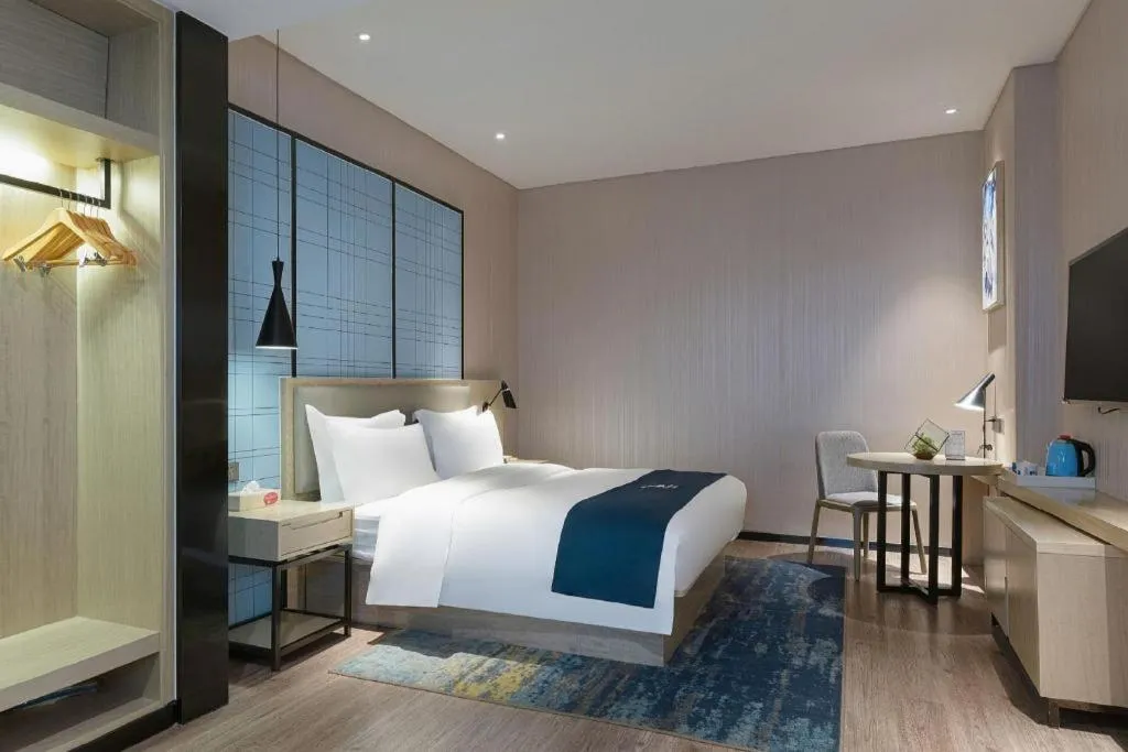 Bed in Echarm Hotel Nanning the MixC Exhibition Center Metro Station