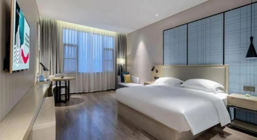 Bed in Echarm Hotel Nanning the MixC Exhibition Center Metro Station