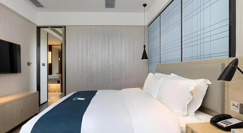 Bed in Echarm Hotel Nanning the MixC Exhibition Center Metro Station