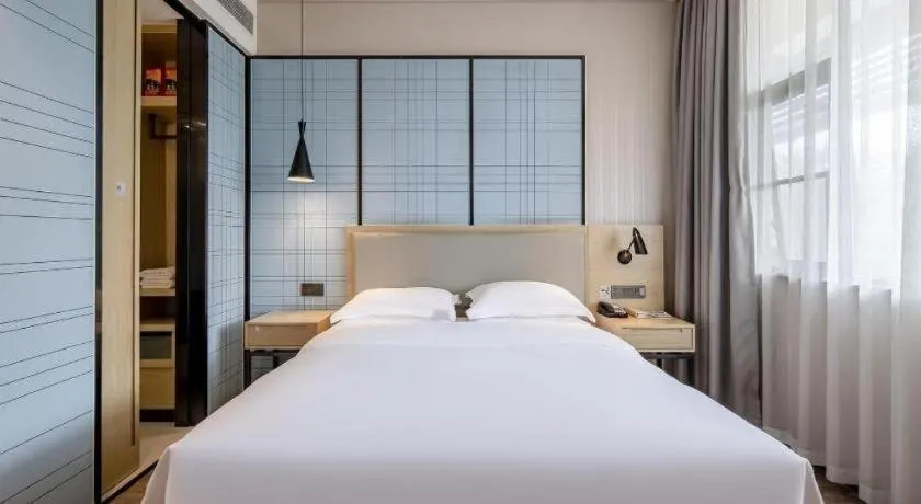 Bed in Echarm Hotel Nanning the MixC Exhibition Center Metro Station
