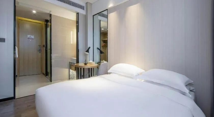 Bed in Echarm Hotel Nanning the MixC Exhibition Center Metro Station