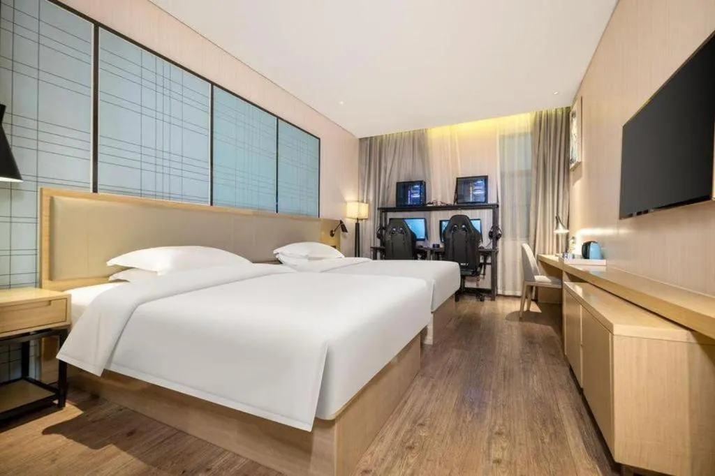Bed in Echarm Hotel Nanning the MixC Exhibition Center Metro Station