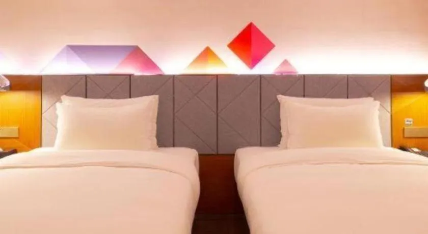 Bed in Borrman Hotel Zhanjiang Xuwen Port Terminal