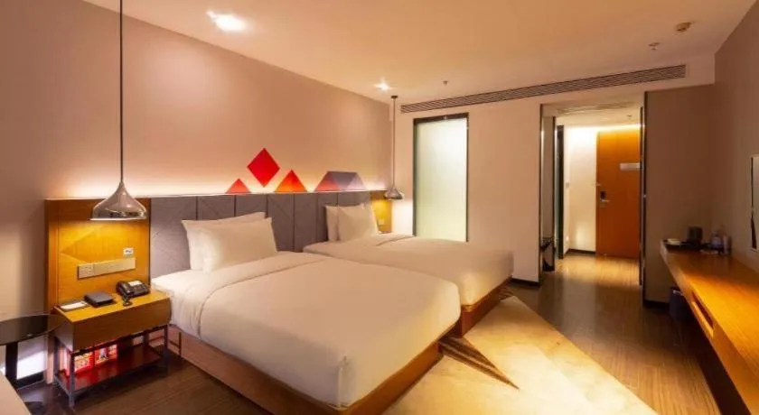 Bed in Borrman Hotel Zhanjiang Xuwen Port Terminal