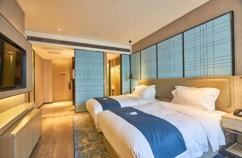 Bed in Echarm Hotel Liuzhou High-speed Railway Station