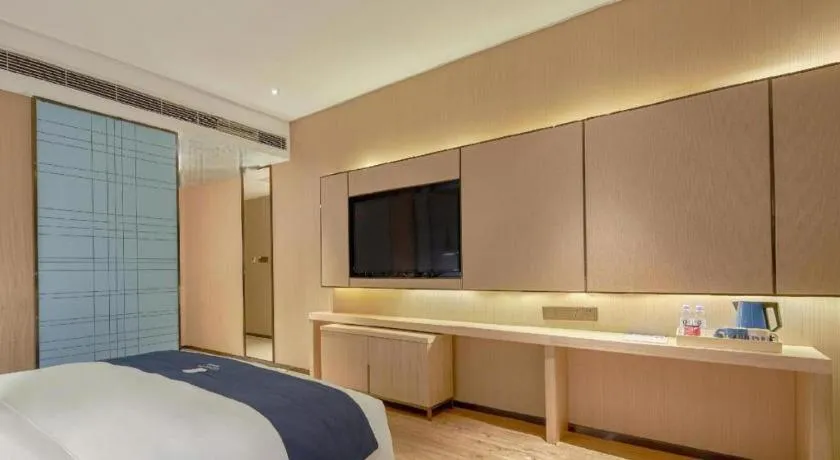 Bed in Echarm Hotel Liuzhou High-speed Railway Station