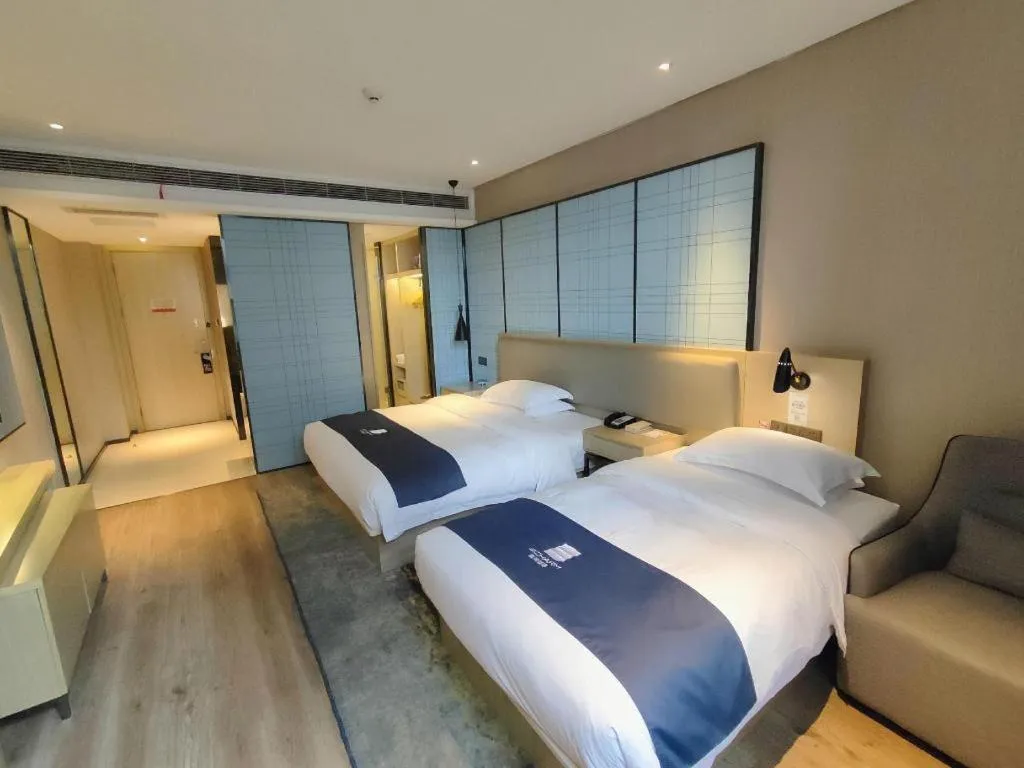 Bed in Echarm Hotel Liuzhou High-speed Railway Station