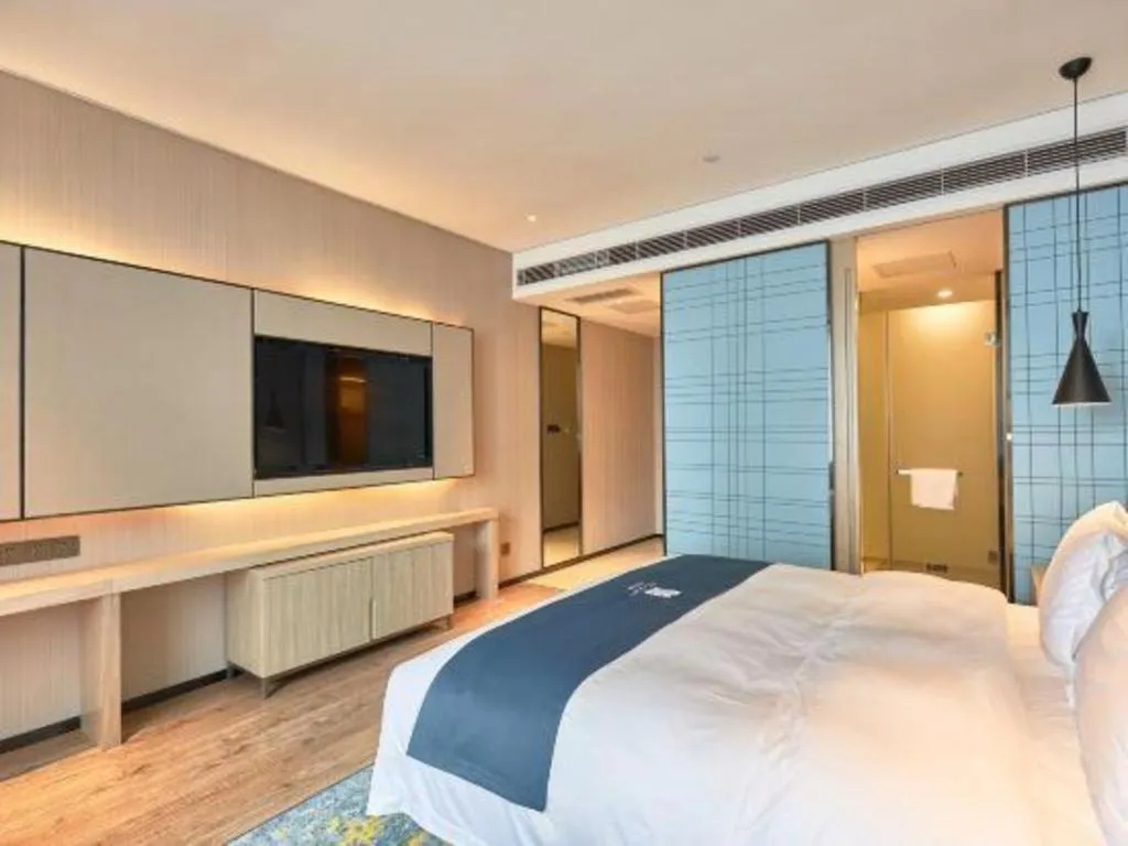 Bed in Echarm Hotel Liuzhou High-speed Railway Station