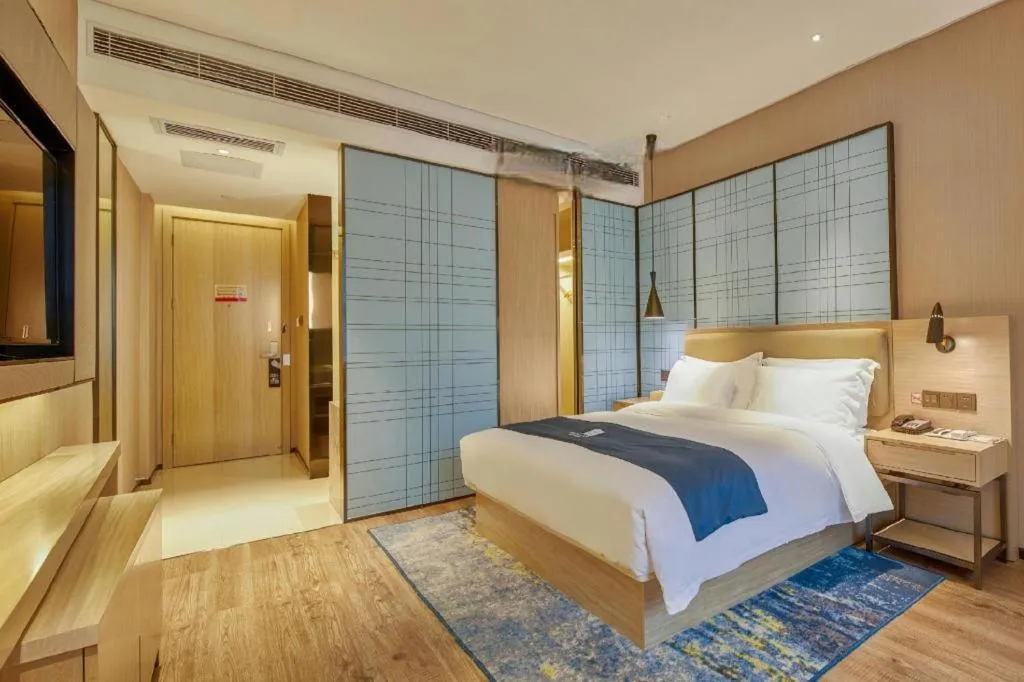 Bed in Echarm Hotel Liuzhou High-speed Railway Station