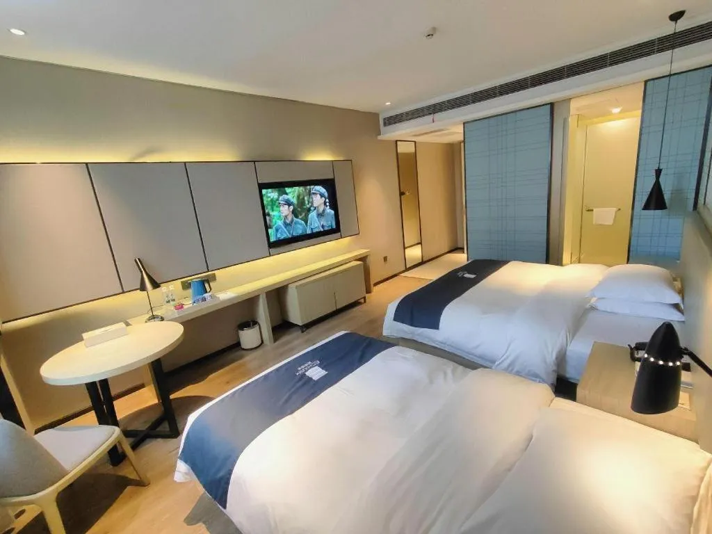 Bed in Echarm Hotel Liuzhou High-speed Railway Station