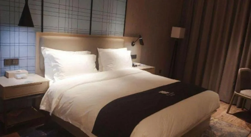 Bed in Echarm Hotel Liuzhou High-speed Railway Station