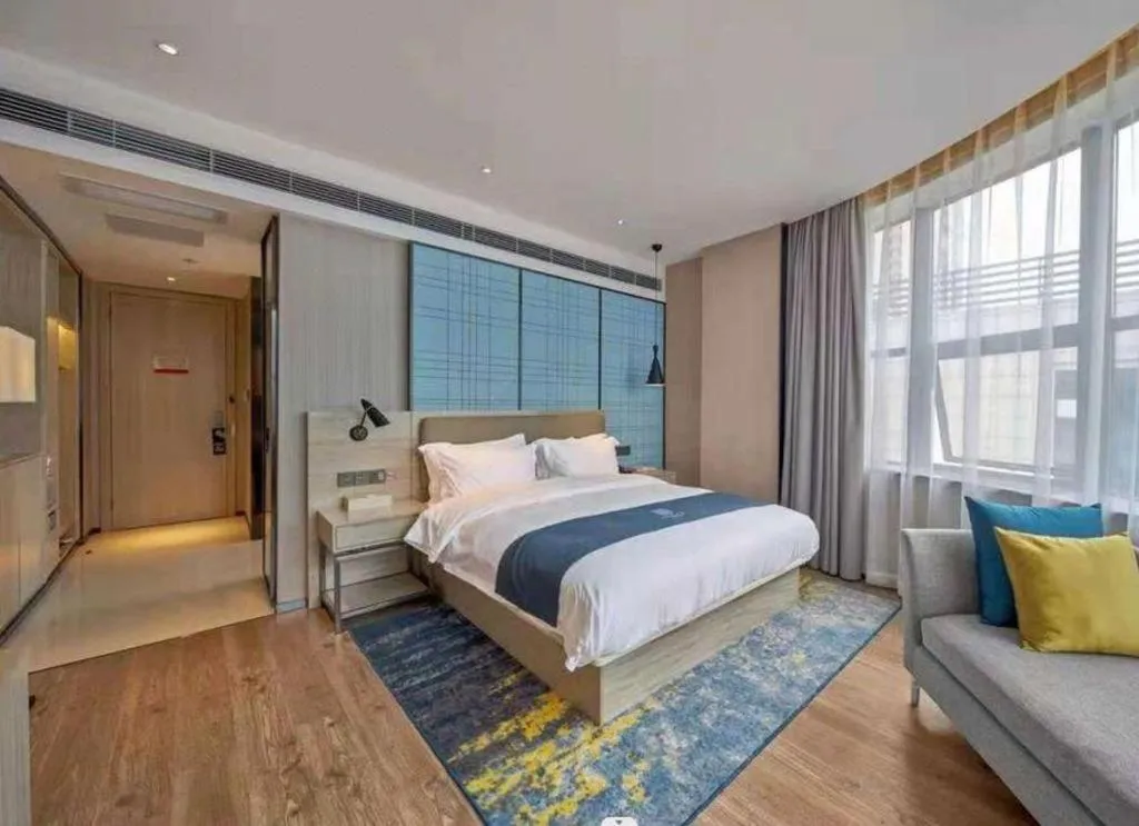 Bed in Echarm Hotel Liuzhou High-speed Railway Station