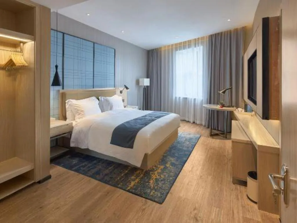 Bed in Echarm Hotel Liuzhou High-speed Railway Station