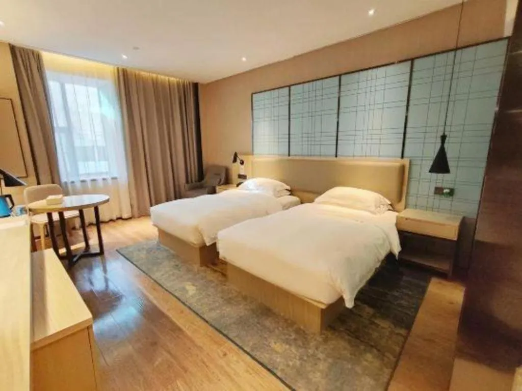 Bed in Echarm Hotel Liuzhou High-speed Railway Station