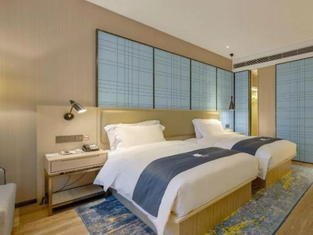 Bed in Echarm Hotel Liuzhou High-speed Railway Station