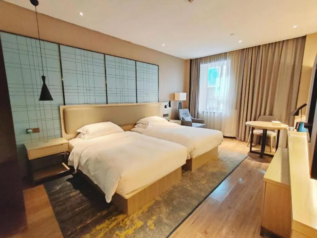 Bed in Echarm Hotel Liuzhou High-speed Railway Station