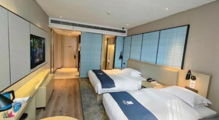 Bed in Echarm Hotel Liuzhou High-speed Railway Station