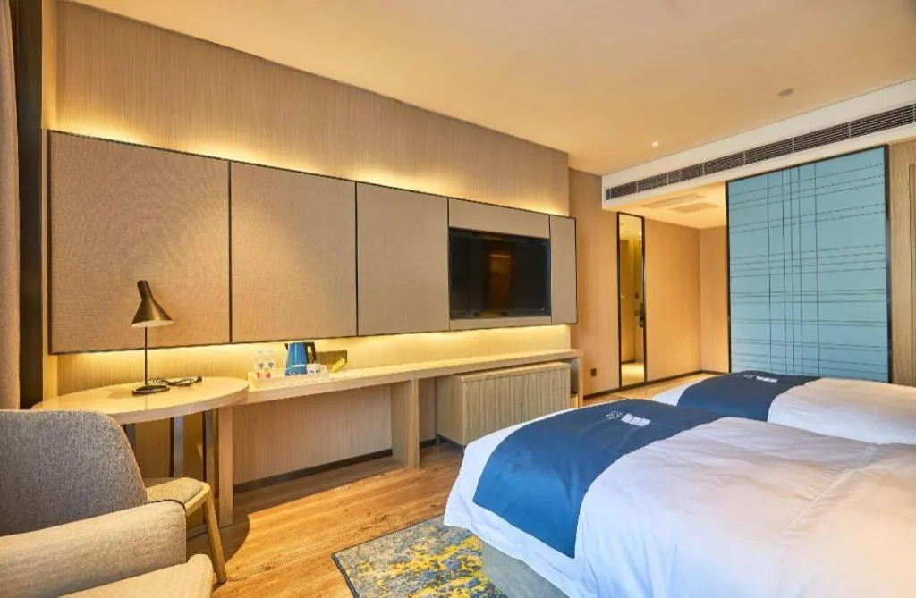 Bed in Echarm Hotel Liuzhou High-speed Railway Station