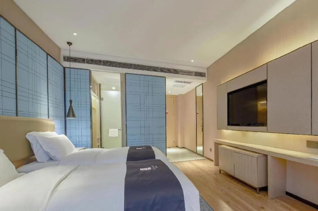Bed in Echarm Hotel Liuzhou High-speed Railway Station