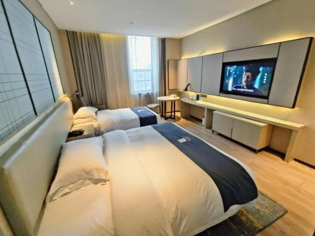 Bed in Echarm Hotel Liuzhou High-speed Railway Station