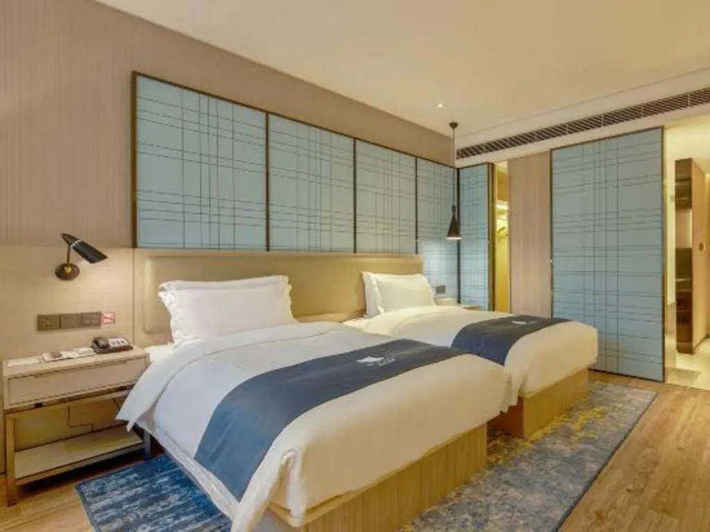 Bed in Echarm Hotel Liuzhou High-speed Railway Station