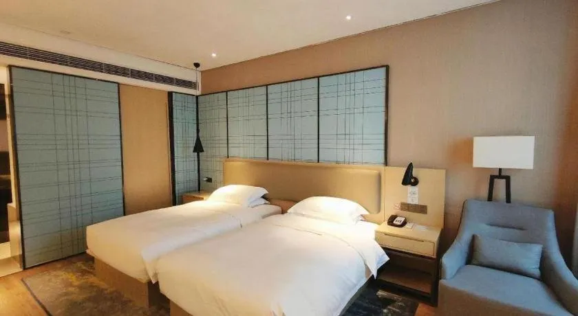 Bed in Echarm Hotel Liuzhou High-speed Railway Station