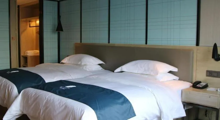 Bed in Echarm Hotel Nanning Qingxiu Mountain