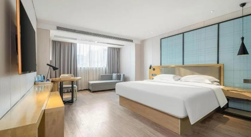 Bed in Echarm Hotel Nanning Qingxiu Mountain