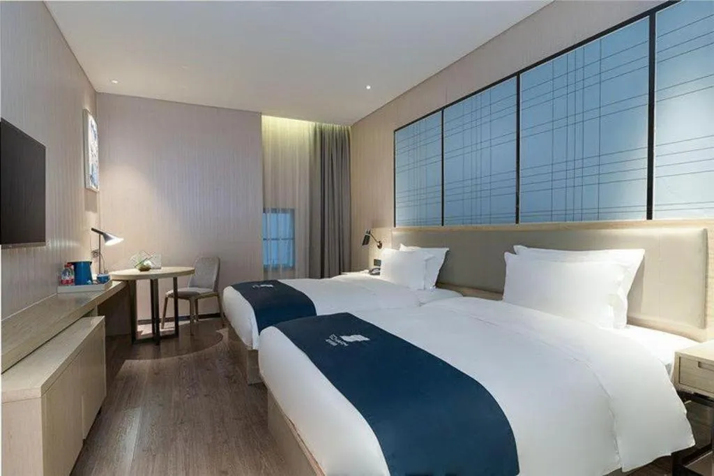 Bed in Echarm Hotel Nanning Qingxiu Mountain