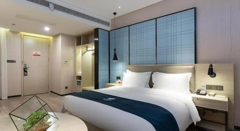 Bed in Echarm Hotel Nanning Qingxiu Mountain