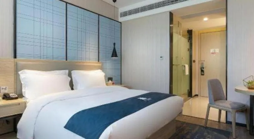 Bed in Echarm Hotel Nanning Qingxiu Mountain