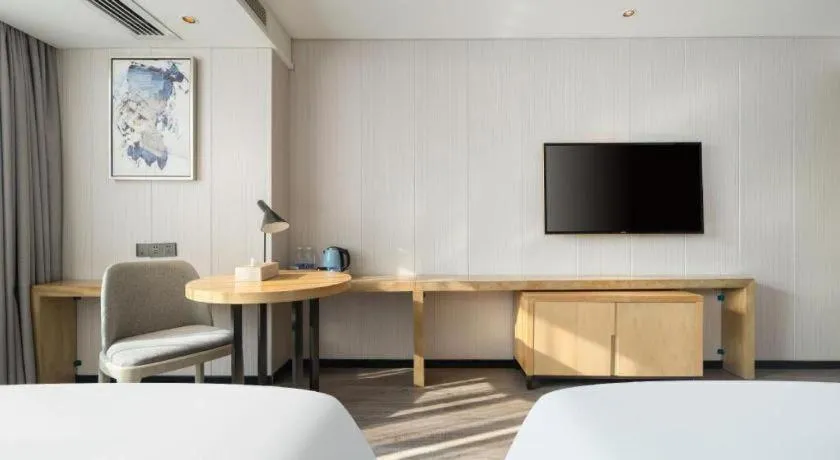 Bed in Echarm Hotel Nanning Qingxiu Mountain