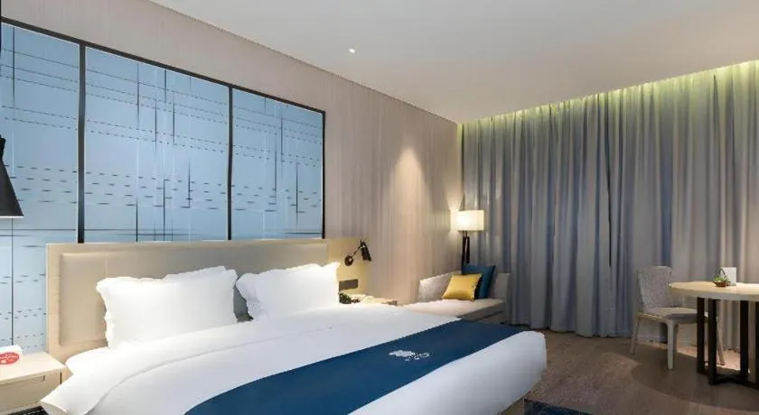 Bed in Echarm Hotel Nanning Qingxiu Mountain