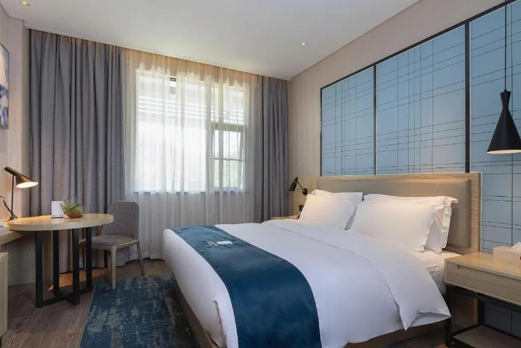 Bed in Echarm Hotel Nanning Qingxiu Mountain