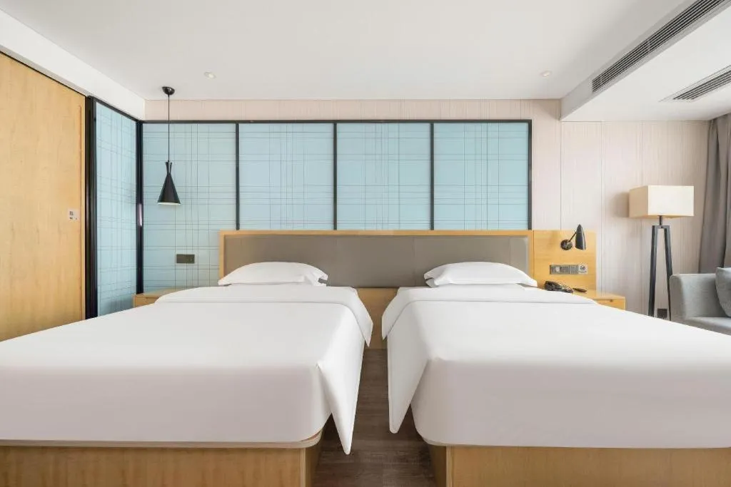 Bed in Echarm Hotel Nanning Qingxiu Mountain