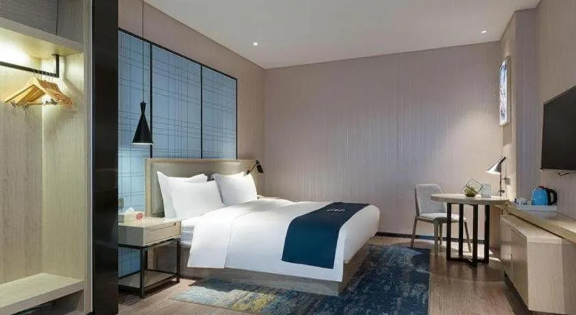 Bed in Echarm Hotel Nanning Qingxiu Mountain