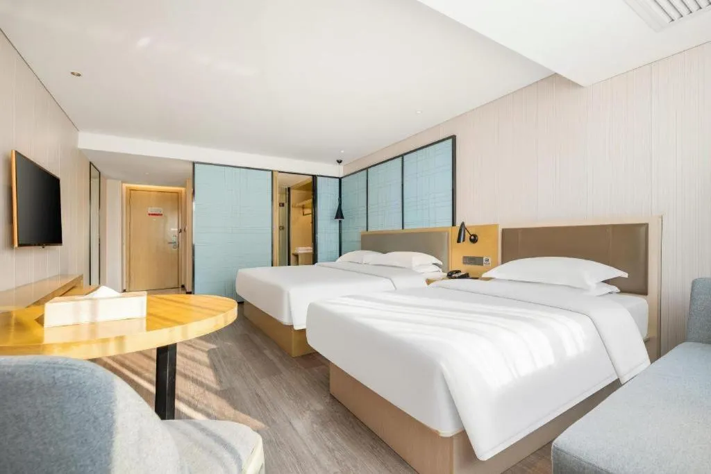 Bed in Echarm Hotel Nanning Qingxiu Mountain