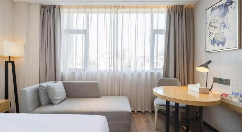 Bed in Echarm Hotel Nanning Qingxiu Mountain