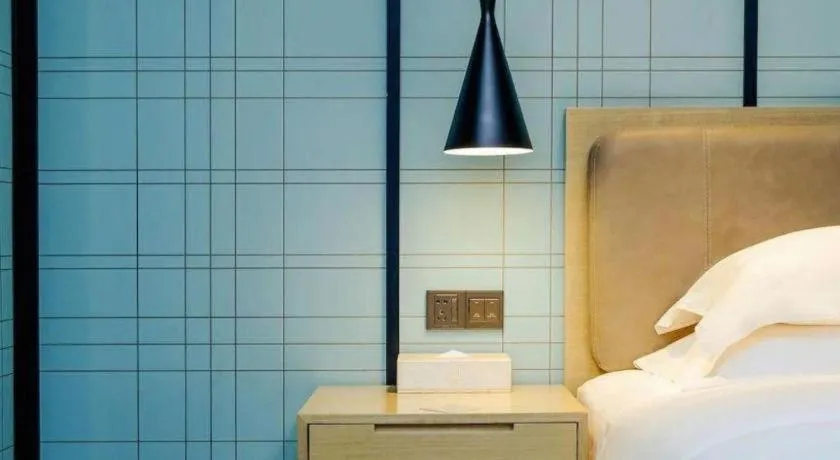 Bed in Echarm Hotel Nanning Qingxiu Mountain